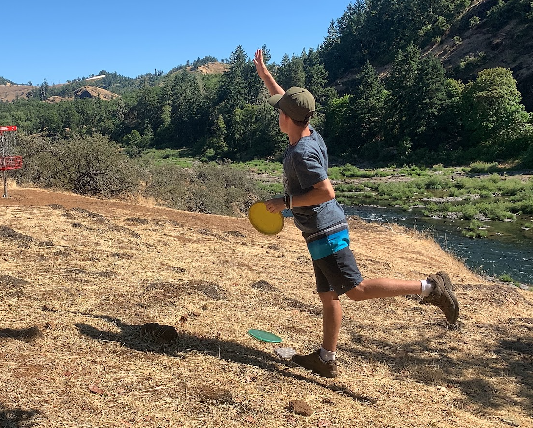 Abraham Johnson putting along the river